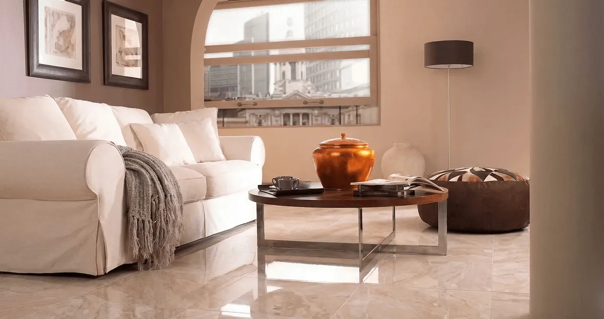 Modern living room with professionally installed marble flooring, a beige sofa, coffee table in Marietta, GA
